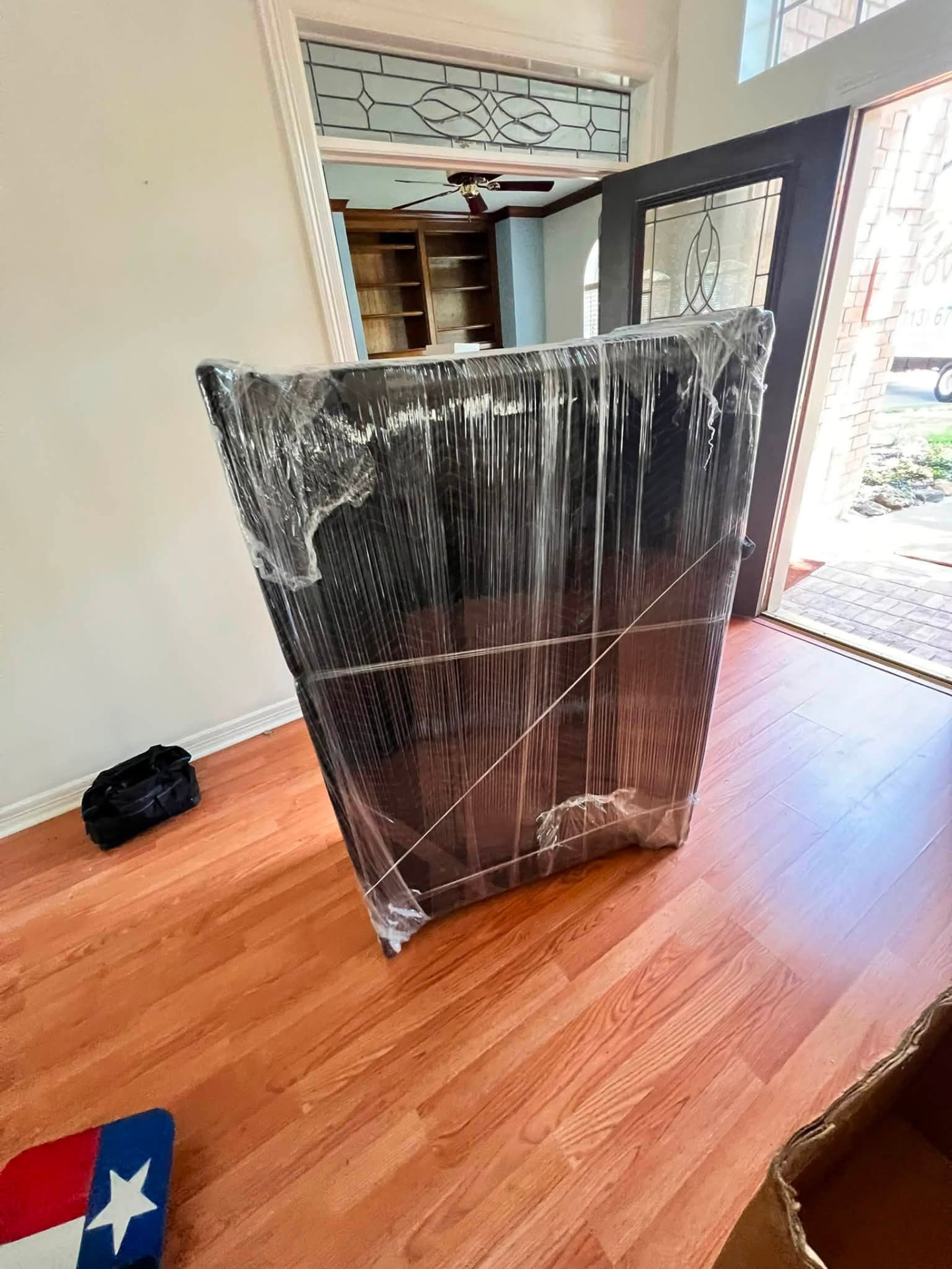 China cabinet fully shrink-wrapped and ready to carry out the front door