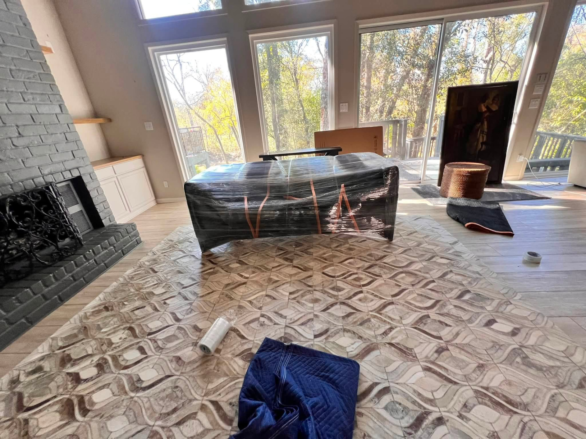 Coffee table shrink-wrapped and taped on protective covering during a move